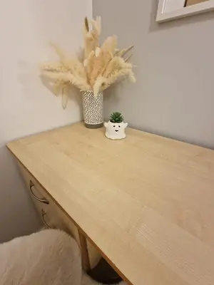 a wooden table with a vase with a plant on it at Luxury house in Kensington for 21 guests in Liverpool