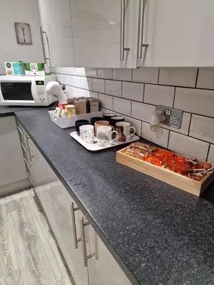 a kitchen counter top with food on it at Luxury house in Kensington for 21 guests in Liverpool