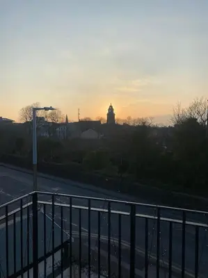 a view of a street with a clock tower in the distance at Williamson House Lancaster in Lancaster