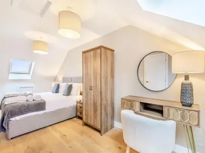 a bedroom with a bed and a mirror at Cherry Tree Cottage - Uk47756 in Mellor