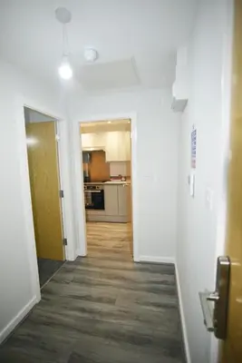 an empty hallway with a hallway leading to a kitchen at Liverpool Nightlife Spot City Centre 1BD apartment and Sofa bed in Liverpool