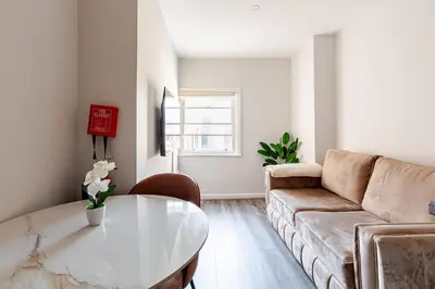 a living room with a couch and a table at 1-BD Apartment with Sofa Bed In The Heart of Liverpool in Liverpool