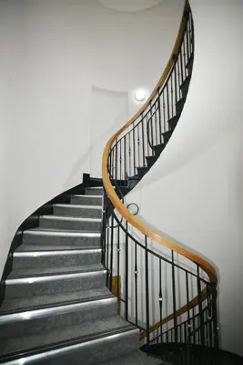 a staircase with black and wooden railings in a building at 1-BD Apartment with Sofa Bed In The Heart of Liverpool in Liverpool