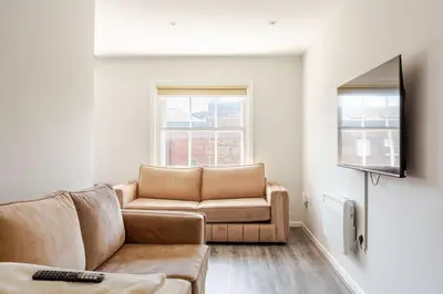 a living room with a couch and a tv at Liverpool City Stay 1-Bed apartment with 2 Sofa Beds, Sleeps up to 6 in Liverpool
