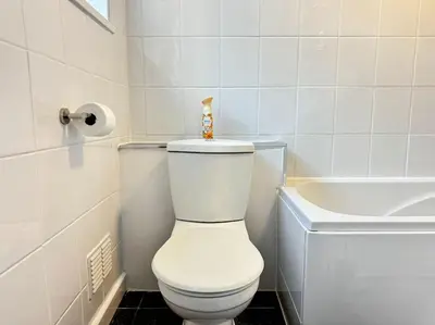 a bathroom with a white toilet and a sink at TV in Every Room Free Parking in Liverpool