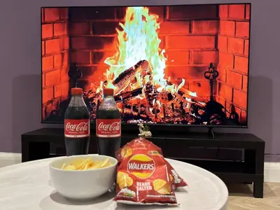 a table with cocacola soda and chips and a fireplace at Contractors and Groups with Parking in Liverpool
