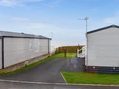 a couple of buildings next to each other at Stay And Sea in Heysham