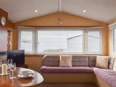 a living room with a couch and a table at Stay And Sea in Heysham