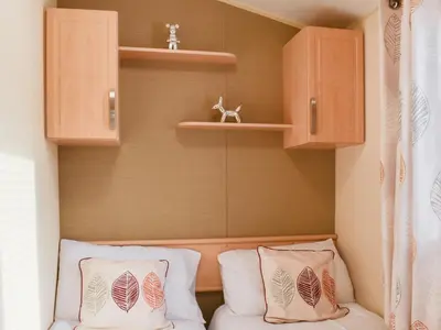 a small room with two pillows on a couch at Stay And Sea in Heysham
