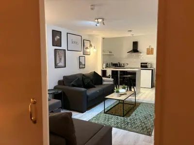 a living room with a couch and a table at Jude's Place 01 in Liverpool