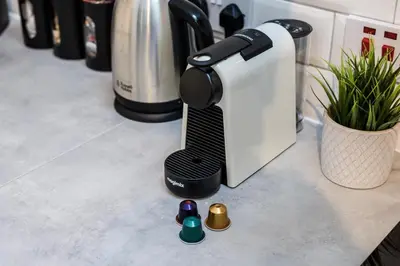 a black and white mixer sitting on a counter at Jude's Place One Bedroom Apartments in Liverpool