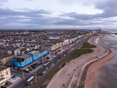 an aerial view of a city with a beach and buildings at Lyndene Hotel in Blackpool