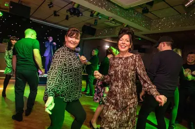 two women dancing on the dance floor at a party at Lyndene Hotel in Blackpool