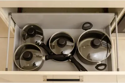 four metal pots and pans in a drawer at Anfield Haven for 6 in Liverpool
