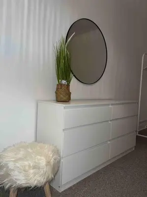 a mirror sitting on top of a dresser with a plant at Parking Walk to Tower Winter Gardens and Main Attractions in Blackpool
