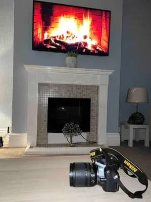a camera in a living room with a fire place at Parking Walk to Tower Winter Gardens and Main Attractions in Blackpool