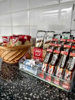 a counter with a bunch of food and a basket at Parking Walk to Tower Winter Gardens and Main Attractions in Blackpool