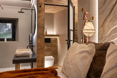 a bedroom with a mirror and a bed in a room at Mead Cottage a Tranquil Retreat in the Heart of the Lake District - Ridgestone in Lindale