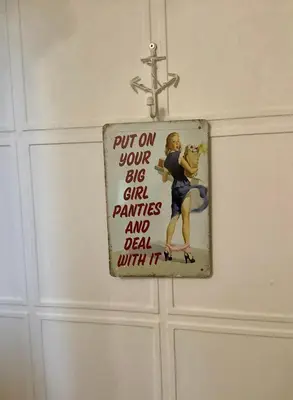 a sign on a door that says put on your sins girl paintings and dead with at Lorton Villa with a Log Burner in Saint Helens