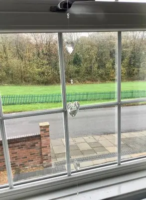 a window view of a street with a broken glass at Lorton Villa with a Log Burner in Saint Helens