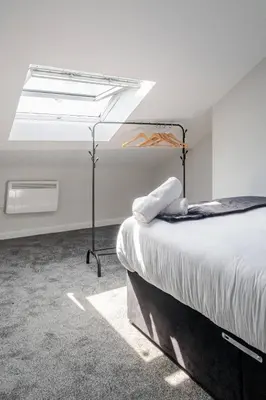 a bedroom with a bed and a skylight at 1-Bed apartment with Sofa Bed right by Liverpool ONE & Concert Square in Liverpool