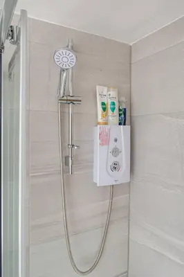 a shower in a bathroom with a shower at 1-Bed Apartment With Sofa Bed in City Centre, Steps from Bold Street and Nightlife in Liverpool