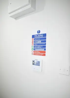 a sign on the side of a refrigerator at 1-Bed Apartment With Sofa Bed in City Centre, Steps from Bold Street and Nightlife in Liverpool