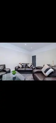 a room with leather beds and a glass table at Cherry Loft in Liverpool