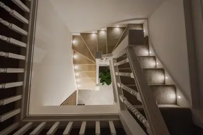 a spiral staircase with a plant in the middle at The Spire! Historic Features Rare 1800s Church in Waterloo