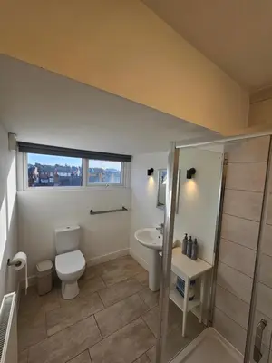 a bathroom with a toilet and a sink at Market Quarter, town centre, free parking and wifi in Southport