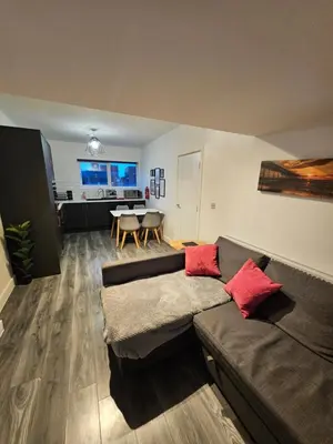 a living room with a couch and a table at Market Quarter, town centre, free parking and wifi in Southport