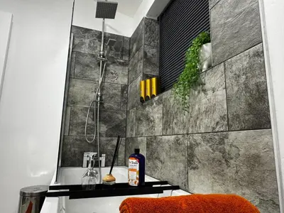 a bathroom with a shower and a bottle of soap at City Link Apartments Perfect Stay for Concert Goers, Football Fans and Contractors, Closer to Liverpool City Centre, Everton, Liverpool Grounds in Liverpool