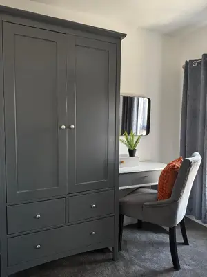 a bedroom with a gray cabinet and a desk at City Link Apartments Perfect Stay for Concert Goers, Football Fans and Contractors, Closer to Liverpool City Centre, Everton, Liverpool Grounds in Liverpool