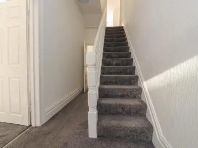 a staircase in a house with a stair case at 21 Eaves Street in Blackpool