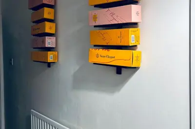 a bunch of boxes hanging on a wall at House - Sleeps 6 Hot-tub & Free Parking in Skelmersdale