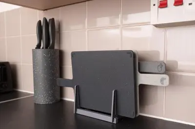 a kitchen counter with a knife block and a knife at Modern 3 bed, sleeps 8 in Saint Helens