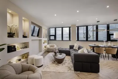 a living room with couches and a dining room at The Shoreline Collection by STAMP in Blackpool