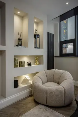 a living room with a chair and a window at The Shoreline Collection by STAMP in Blackpool