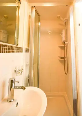 a bathroom with a sink and a shower at Beachcliffe Holiday Apartments in Blackpool