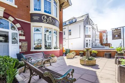 a couple of benches in front of a building at Beachcliffe Holiday Apartments in Blackpool