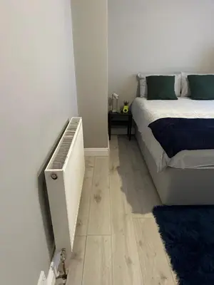 a bedroom with a bed and a television in it at true and fruitful vine by Everton and Liverpool footy club in Liverpool