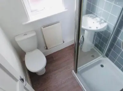 a bathroom with a toilet and a sink and a shower at Ormskirk lets in Ormskirk