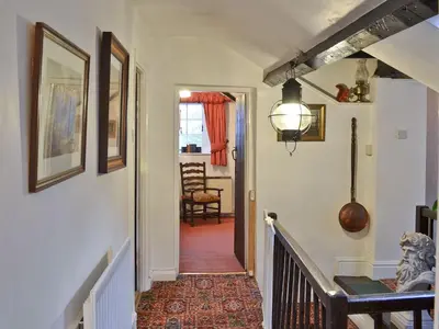 a hallway of a home with a stairway at Tom's Cottage in Dalton in Furness