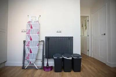 a room with three trash cans and a radiator at Fabulous beachfront 3 bed house with parking in Cleveleys
