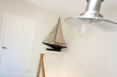 a toy boat on a wall next to a door at Fabulous beachfront 3 bed house with parking in Cleveleys