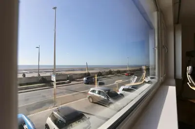 a view from a window of a highway with cars at Fabulous beachfront 3 bed house with parking in Cleveleys