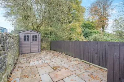 a backyard with a fence and a purple shed at 2 Bed in Oakenclough oc-m30216 in Scorton