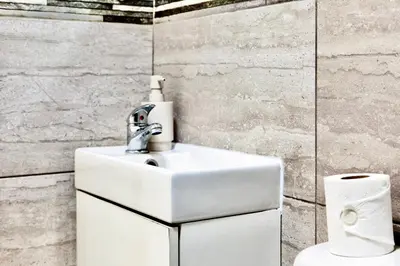 a bathroom with a sink and a toilet at Large 6 Bed House, Long Term Stay Savings, Contractors, Professionals, Big Groups, Free Parking! in Liverpool