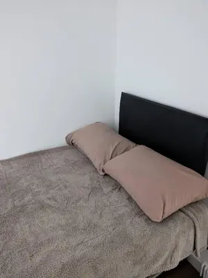 a bed with two pillows on top of it at Best homestay Close To City Centre in Liverpool