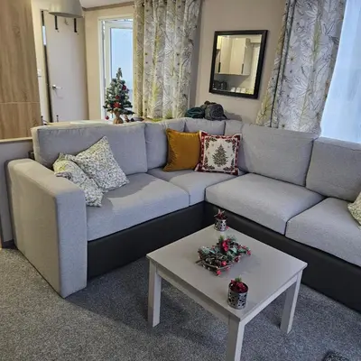 a living room with a couch and a table at Escape in Carnforth Lodge - Sleeps 6 in Carnforth